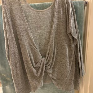 Grey long sleeve sweater with open twisted back